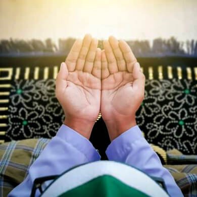 Hands raised in dua inside mosque seeking peace, protection, and spiritual guidance.